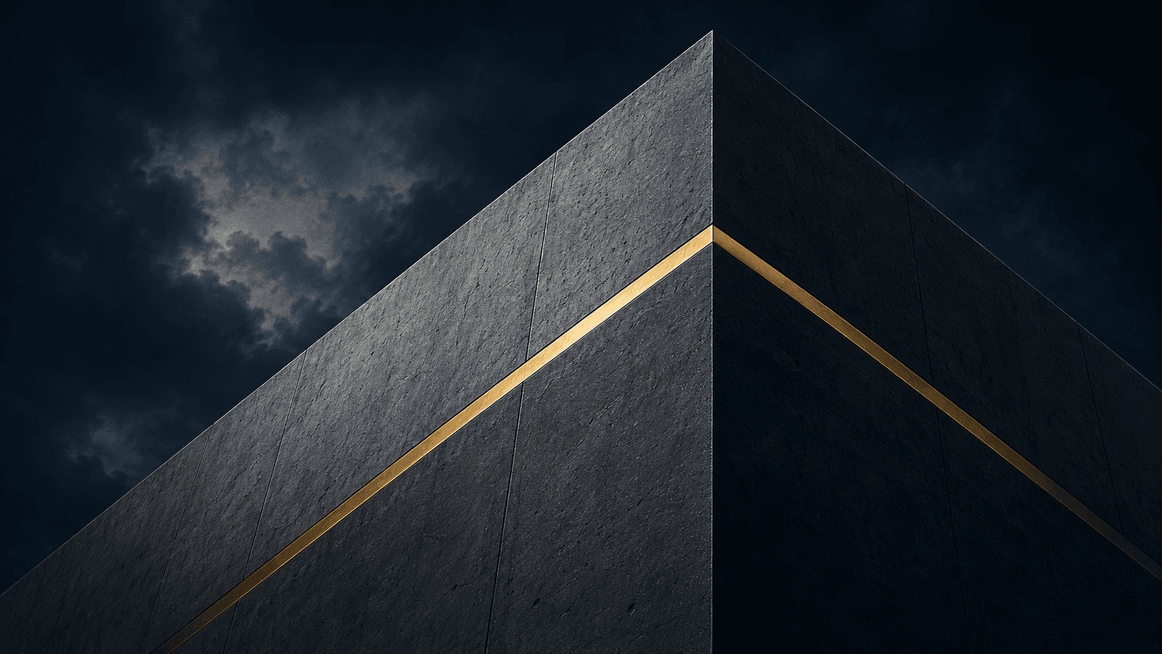 Monumental dark architectural planes divided by a precise illuminated gold boundary.